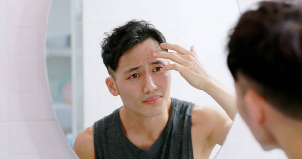 Man checking gym acne men skincare routine